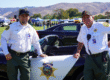Sheriff’s Auxiliary Volunteer Patrol Members Standing in Front of Car