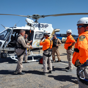 Search and Rescue Volunteers in Front of a Helicopter