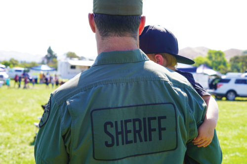 Sheriff Deputy Holding His Son