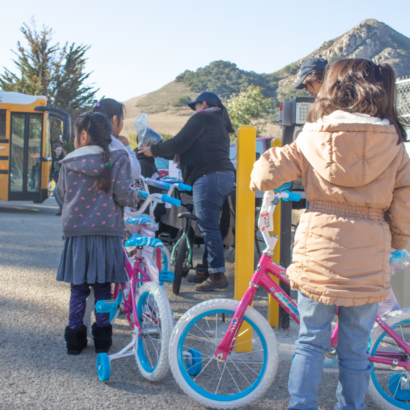 Children Waiting in Line for Bike Helmets