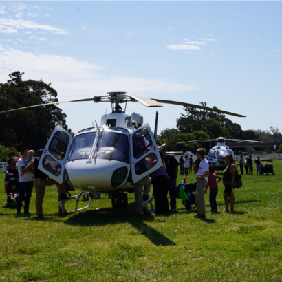 Kids Playing Near Helicopter at Family Day Event