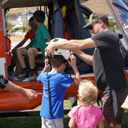 Kids Playing Near Helicopter at Family Day Event