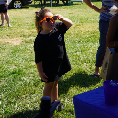 Young Girl with Sunglasses at Family Day Event