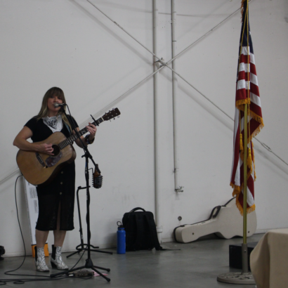 Singer Natalie Haskins Playing Guitar