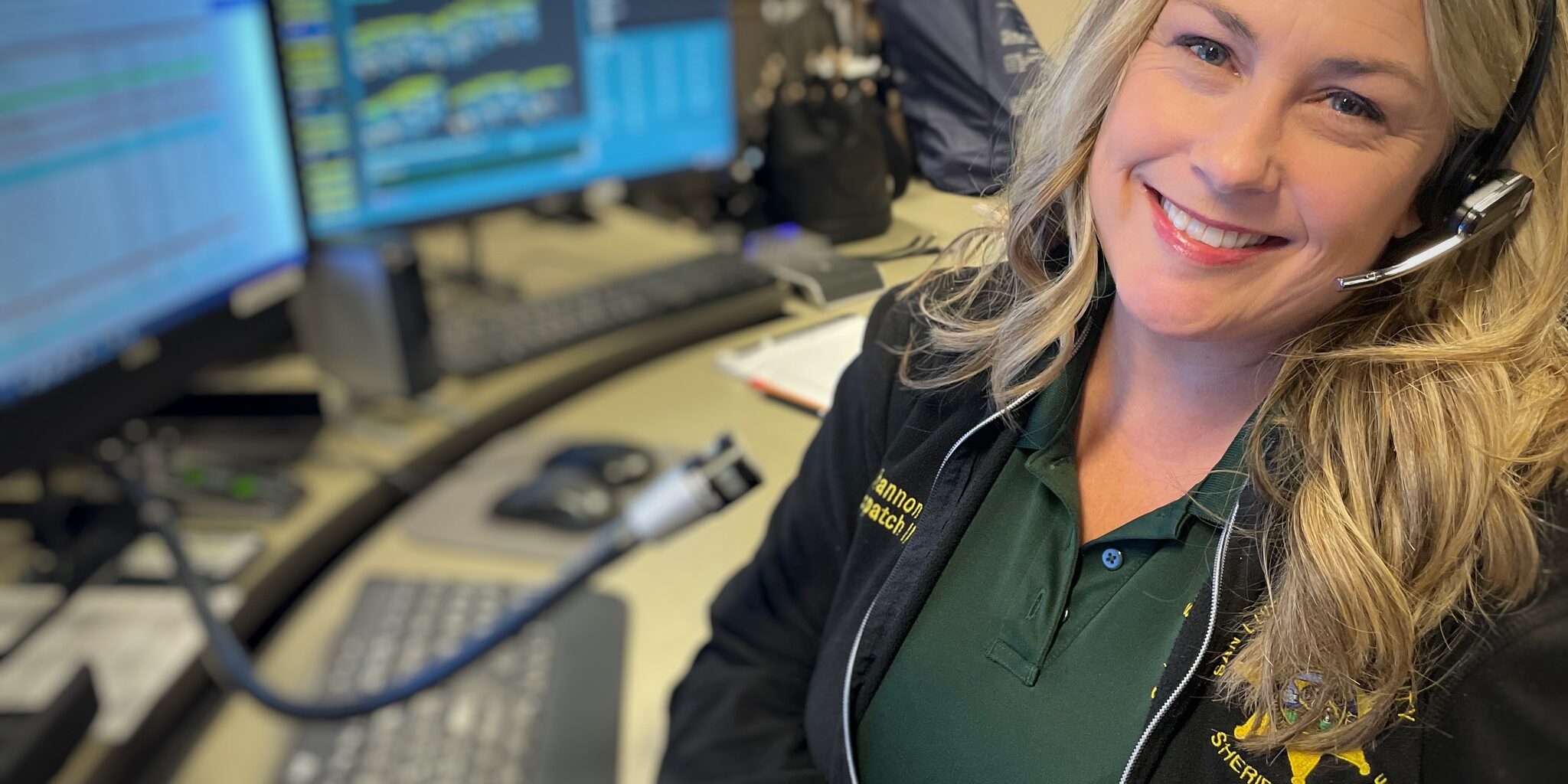 Woman seated at Dispatch Desk for San Luis Obispo County