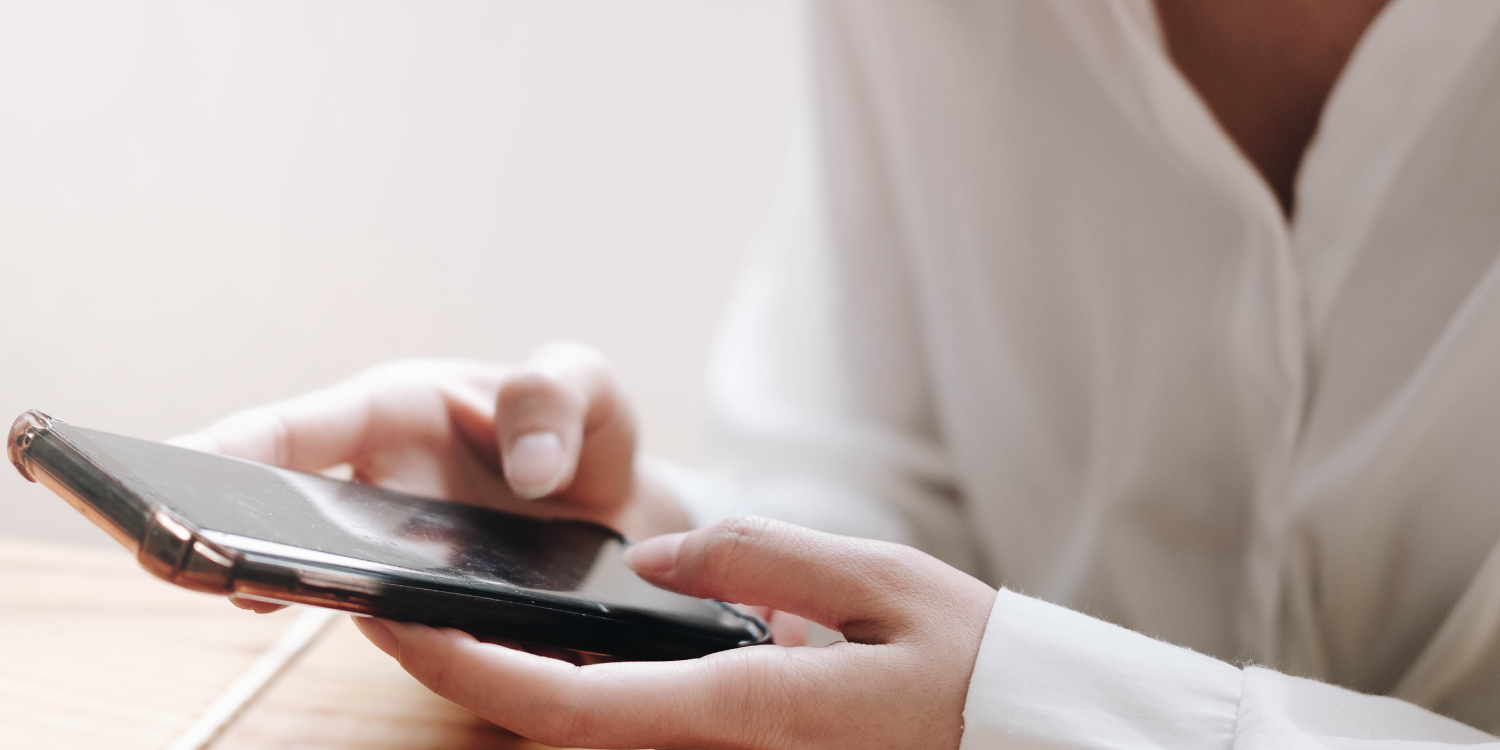 Woman Using Smart Phone to Call in Crime Tip