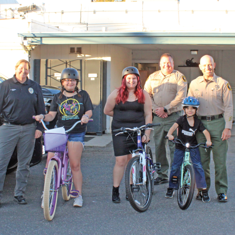 Morro Bay PD and SLO Sherriff Giving out Bikes to Children